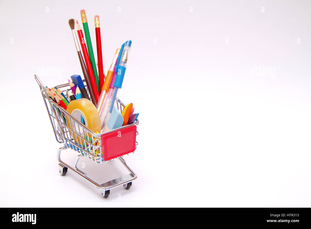 Bag with school tools on white background Stock Photo - Alamy