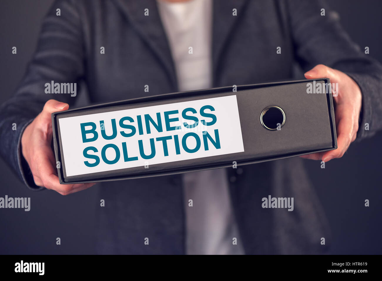 Offering business solution, businesswoman with document ring binder folder Stock Photo