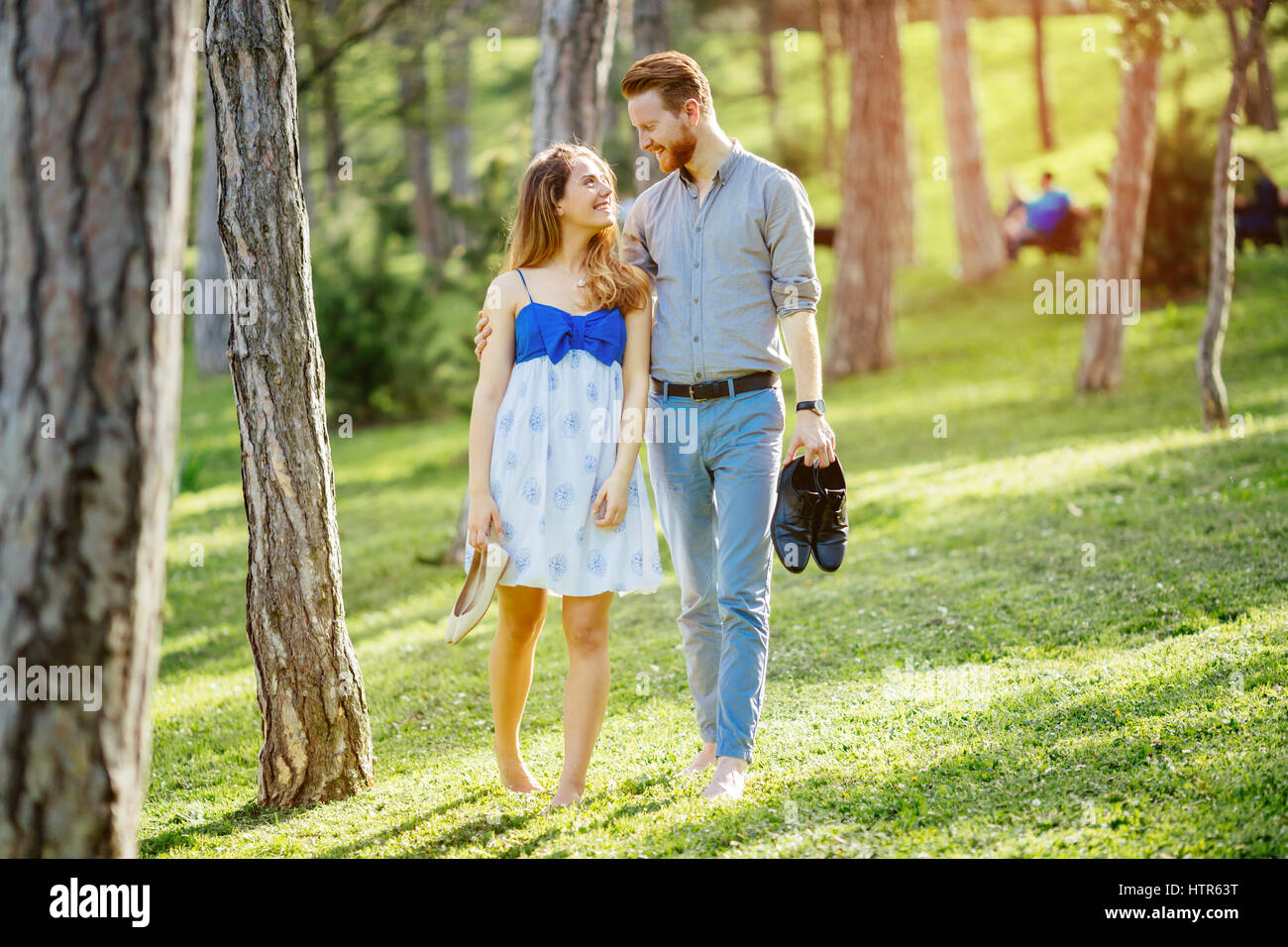 Woman walking in park barefoot hi-res stock photography and images - Alamy