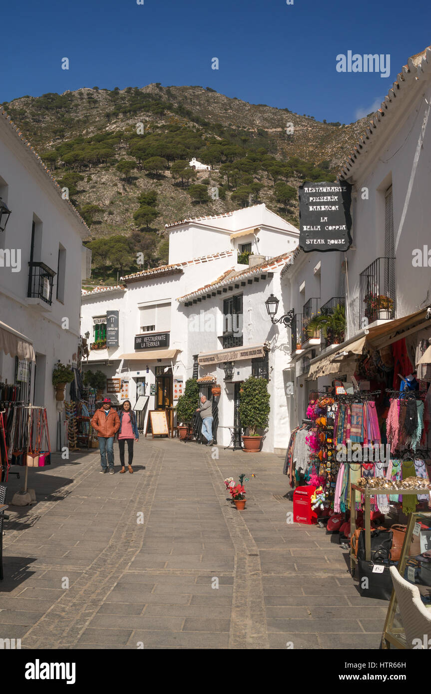 Couple walking, street in the white painted village of Mijas, Andalusia, Spain, Europe Stock Photo