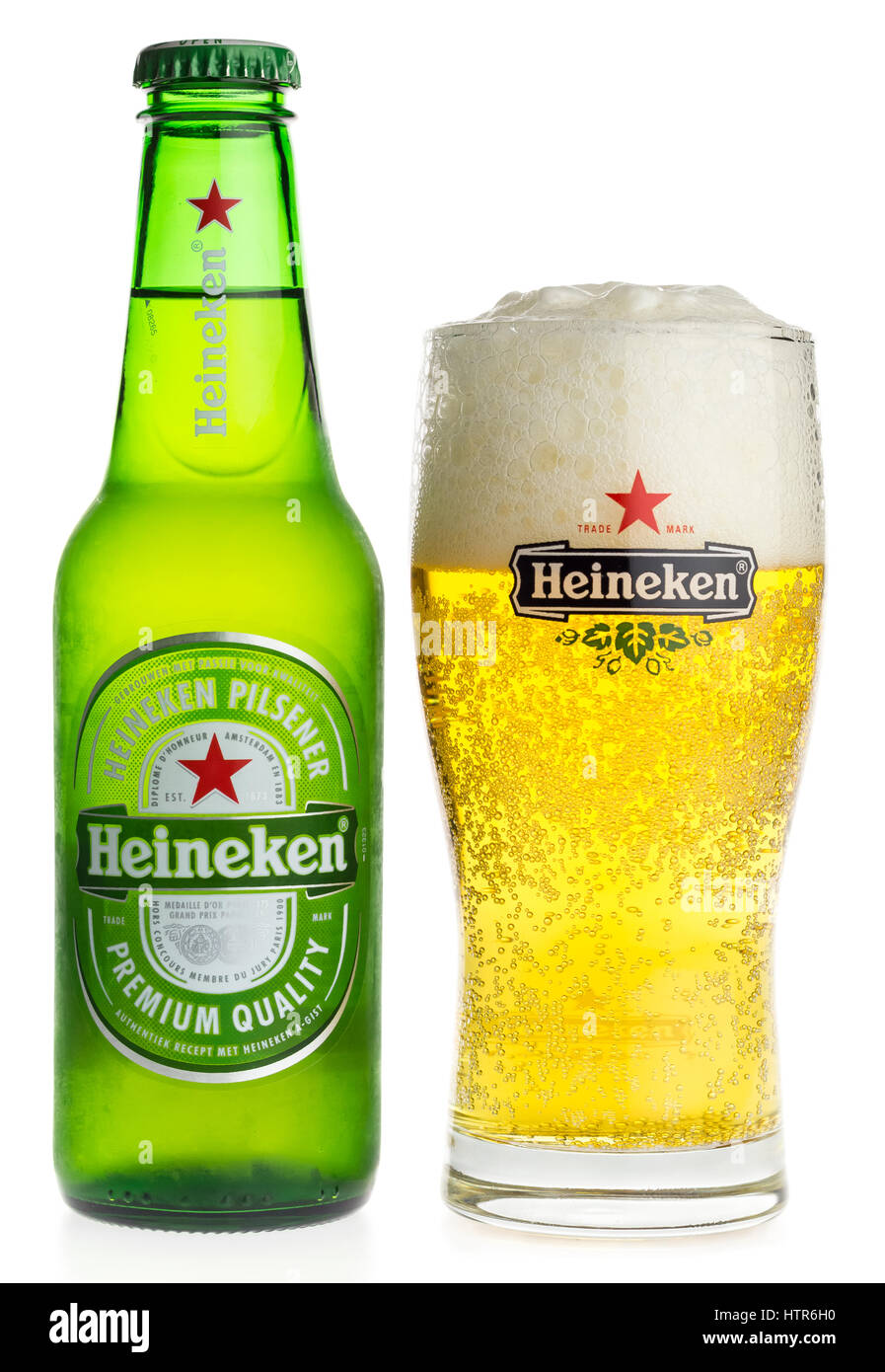 Bottle and glass of Heineken Pilsener beer isolated on a white background Stock Photo