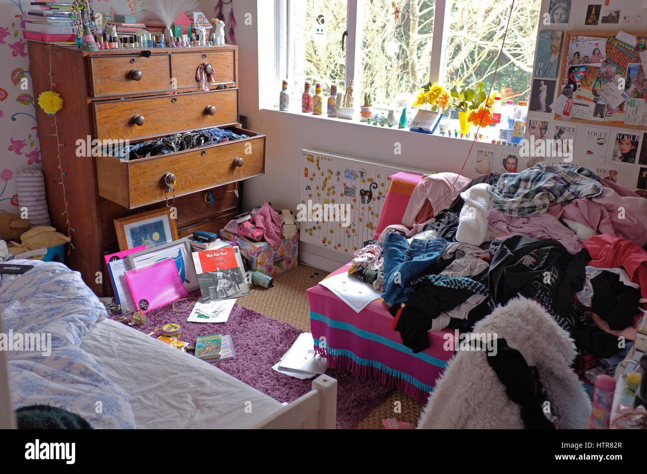 An untidy teenage girls bedroom. Stock Photo