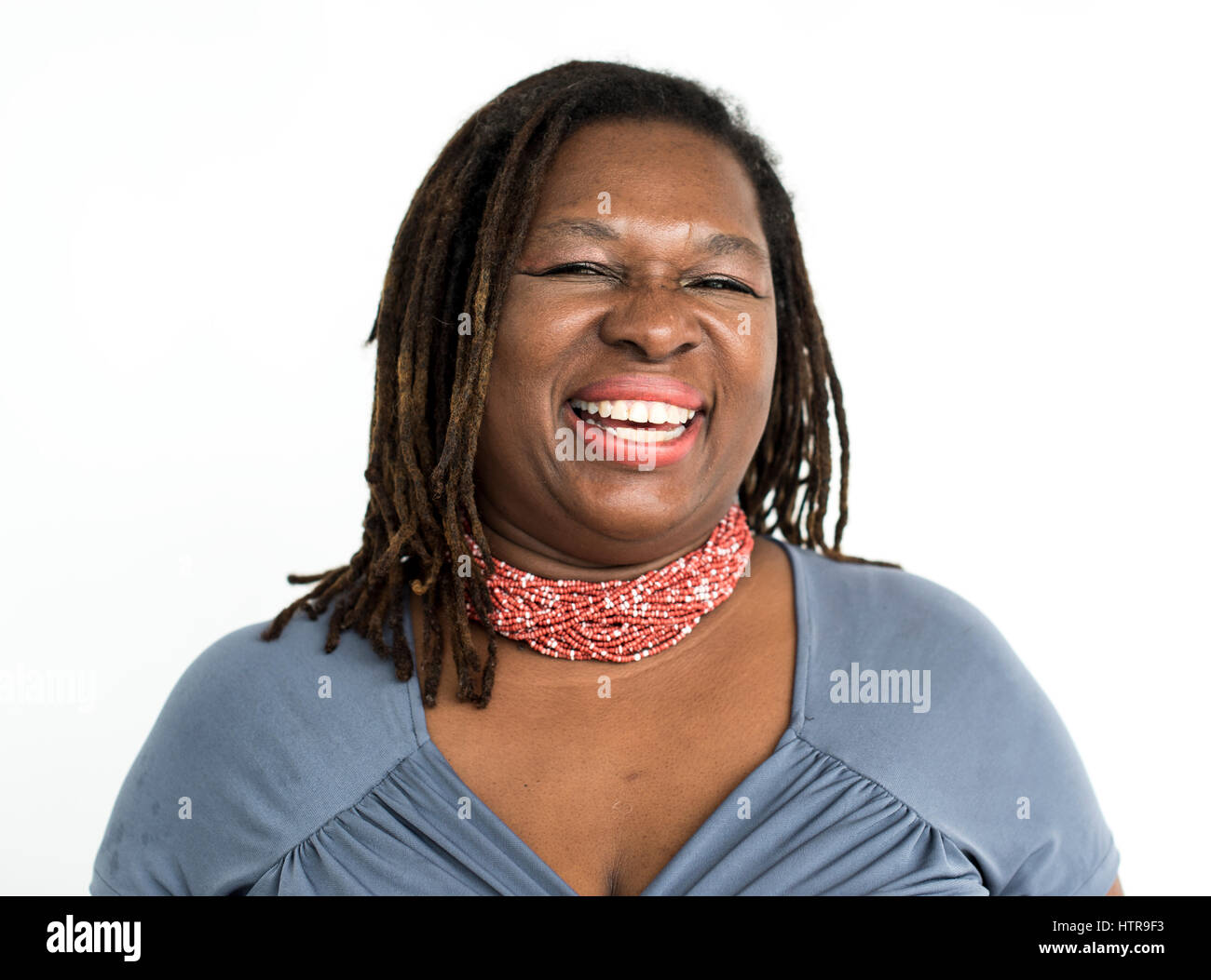 Black woman laughing cheerful studio portrait Stock Photo - Alamy