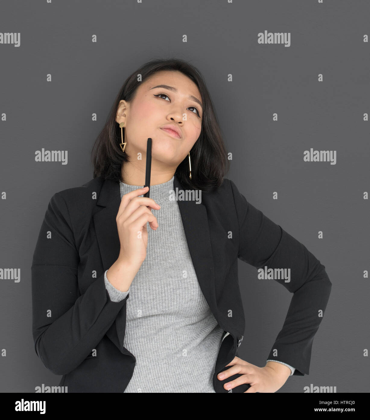 Woman thinking pen hi-res stock photography and images - Alamy