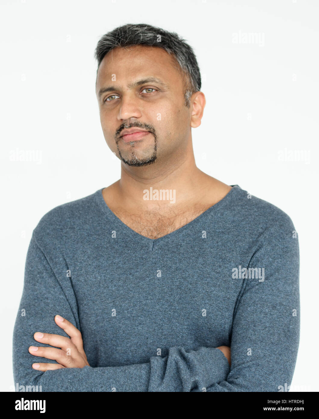 Indian guy arms crossed studio portrait Stock Photo - Alamy
