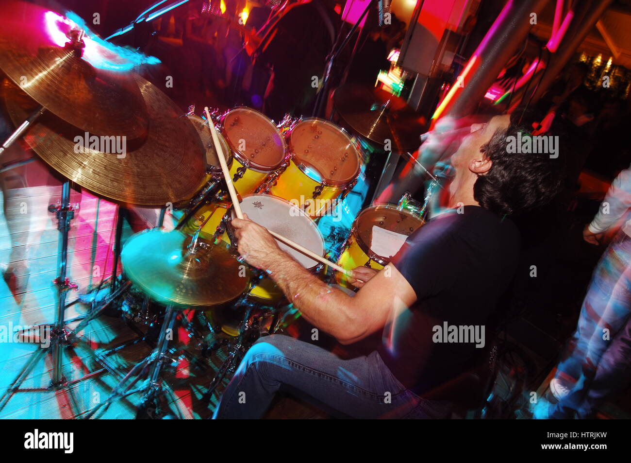 Drummer performing on stage at concert Stock Photo Alamy