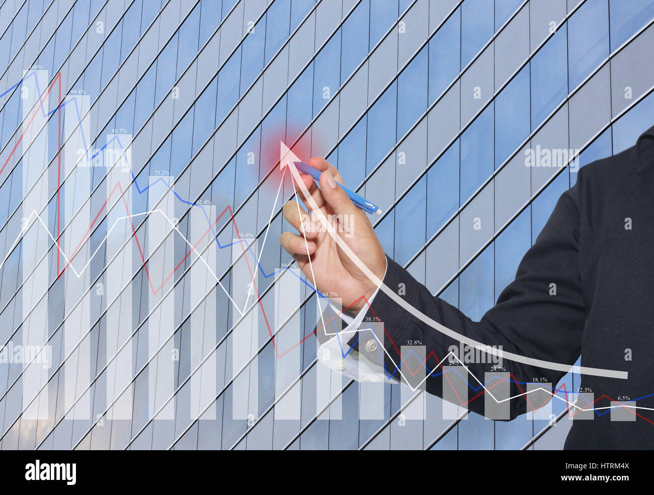 Hand of businessman use a blue pen point to top grow graph in concept ...