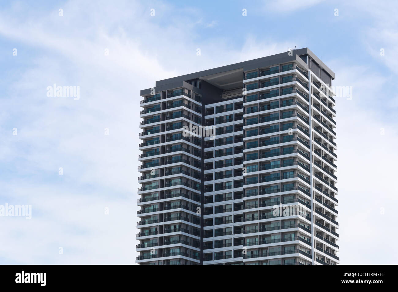 Skyscraper on a background of blue sky Stock Photo - Alamy