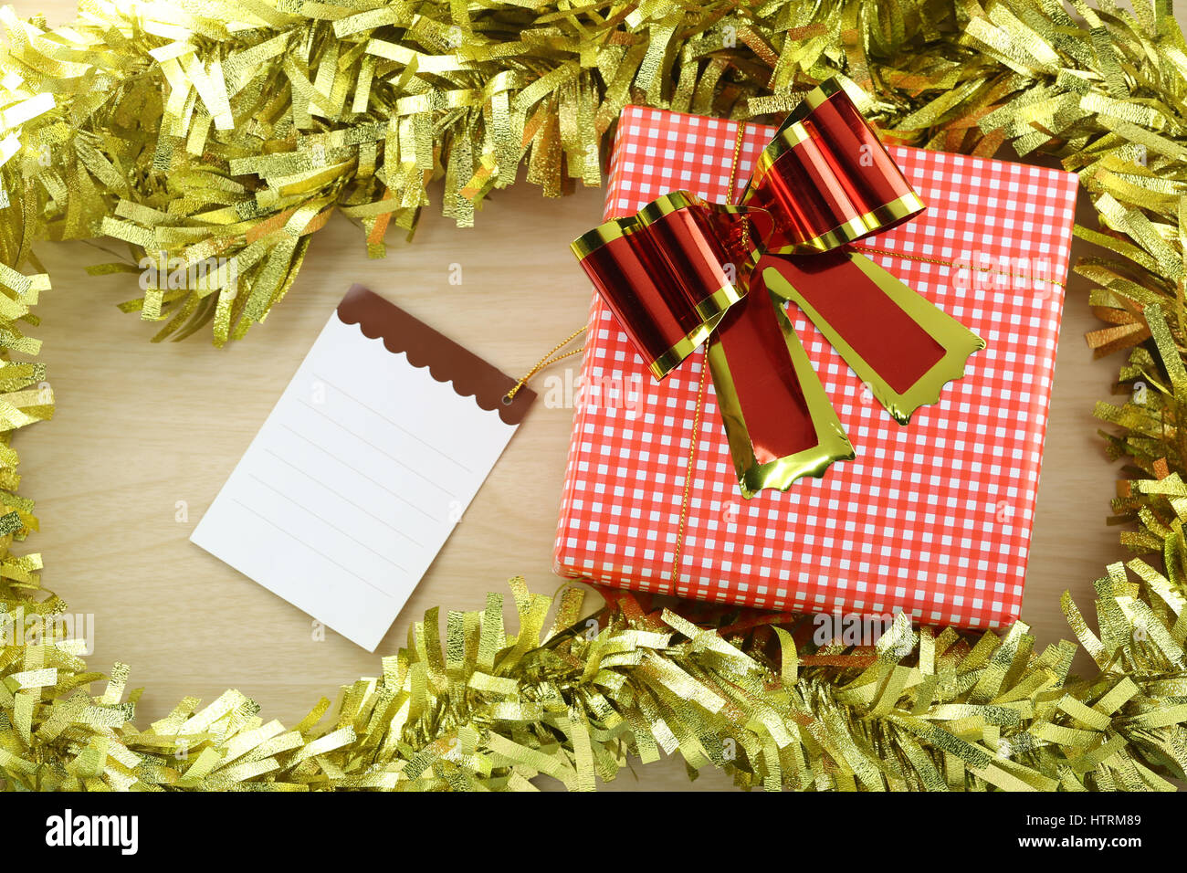 Gift box and Notepad in the concept of Christmas and New Year and special occasions. Stock Photo