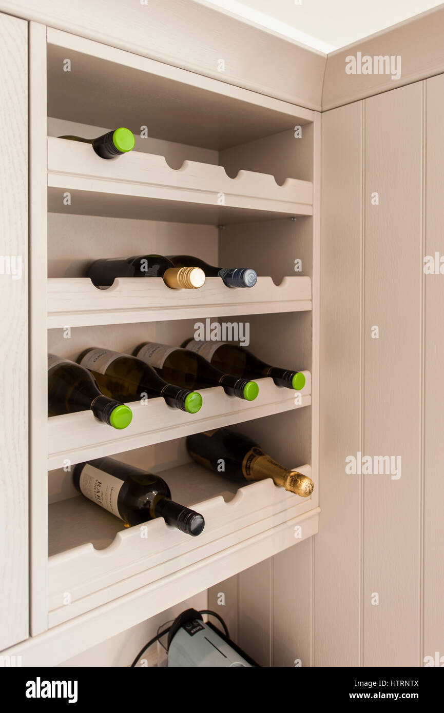 Installed modern wine rack in a contemporary cream coloured kitchen with copy space Stock Photo