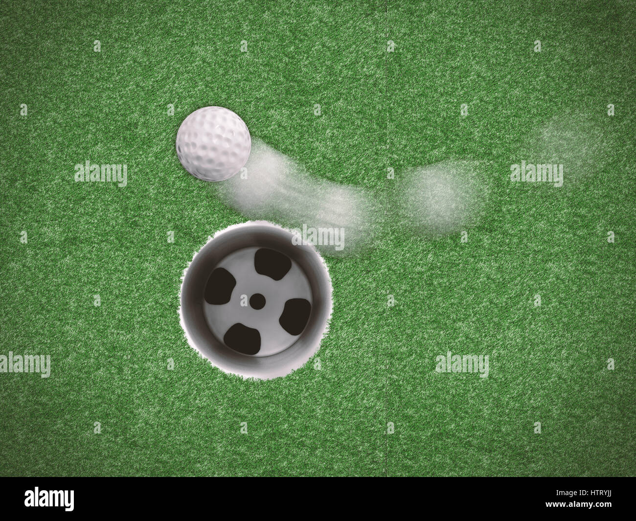 golf ball in motion missing target on green grass Stock Photo Alamy