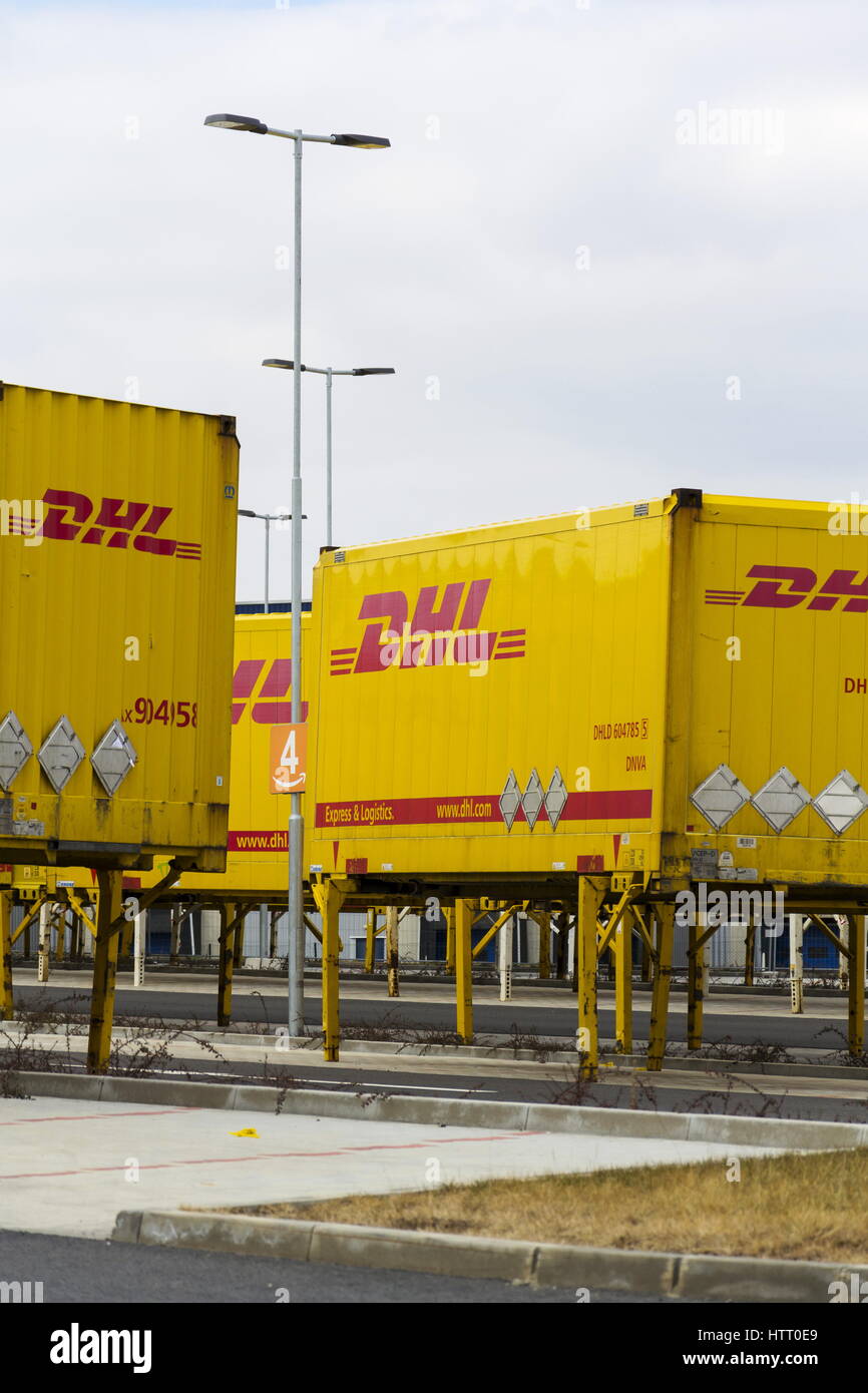 DOBROVIZ, CZECH REPUBLIC MARCH 12 DHL shipping containers in front