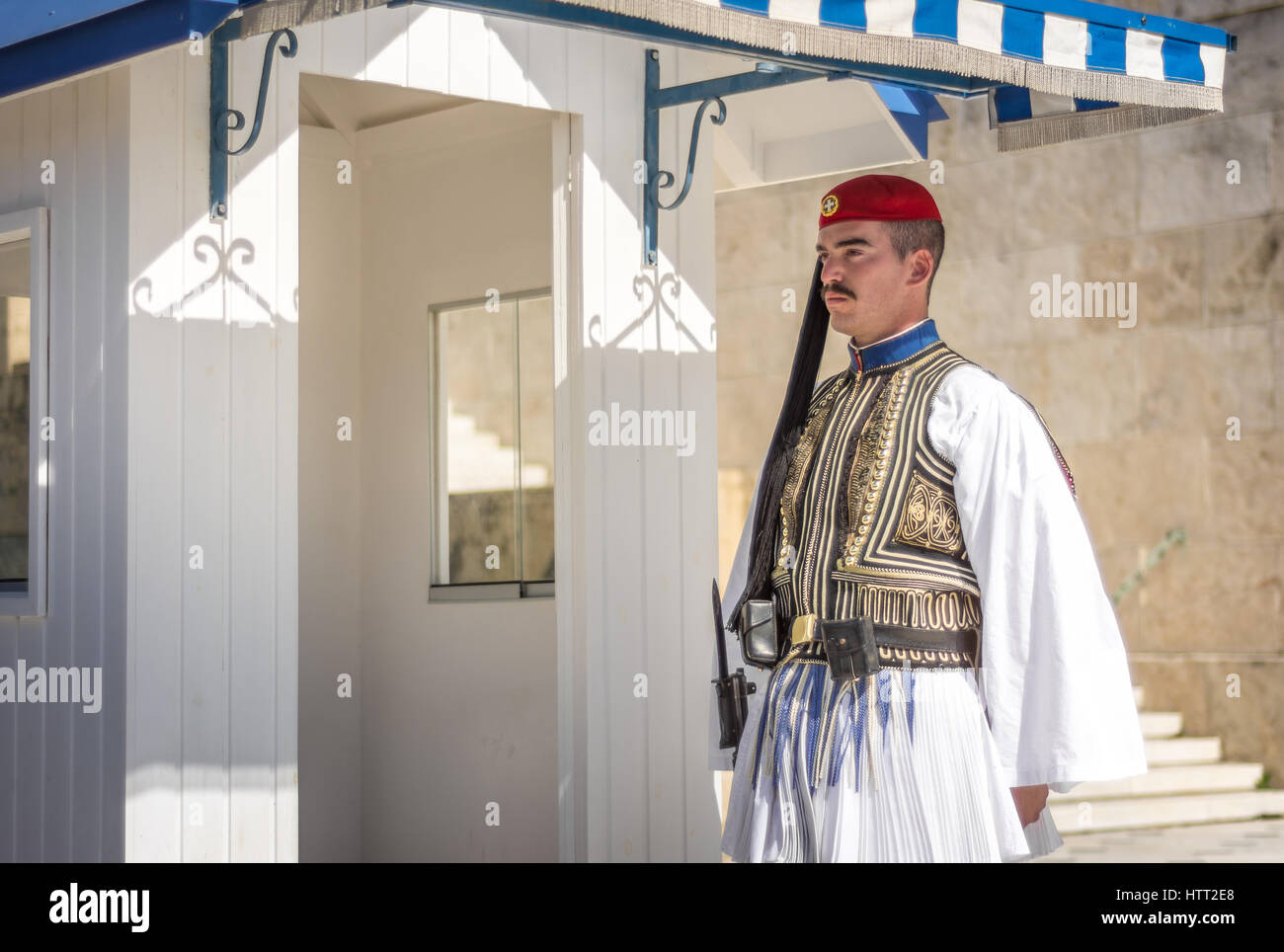 Athens, Greece - March 5, 2017: Evzonas dressed in traditional Greek army uniform (Tsolias) standing guard at the Unknown Soldier Tomp monument Stock Photo