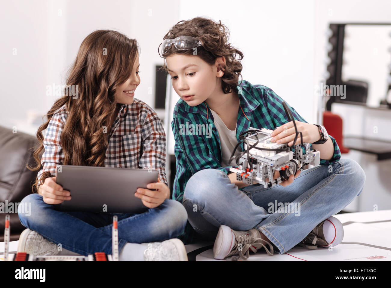 Curious friends using modern gadgets and devices at home Stock Photo