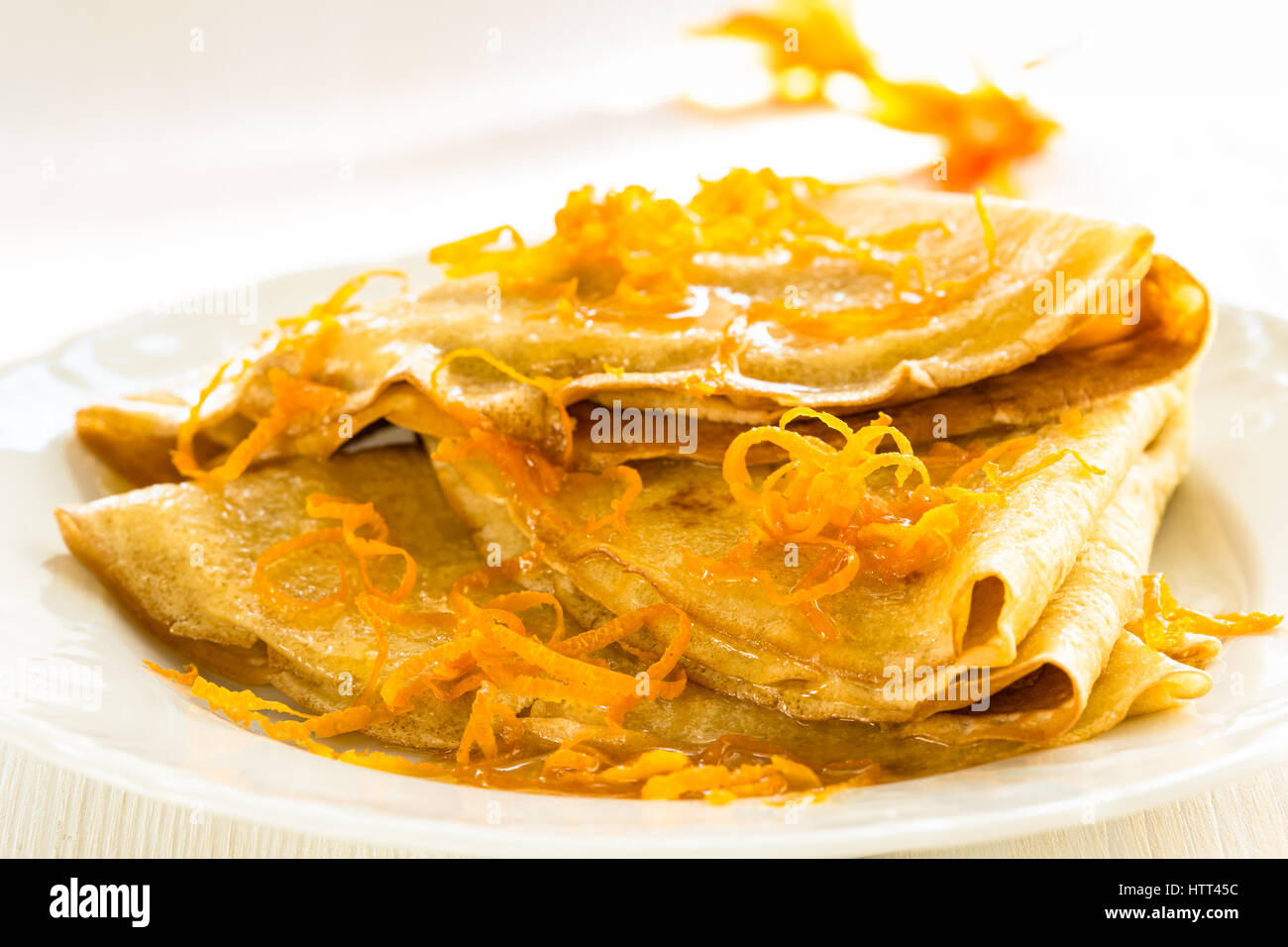 Pancakes with sweet citrus sauce, classic French dessert crepes Suzette