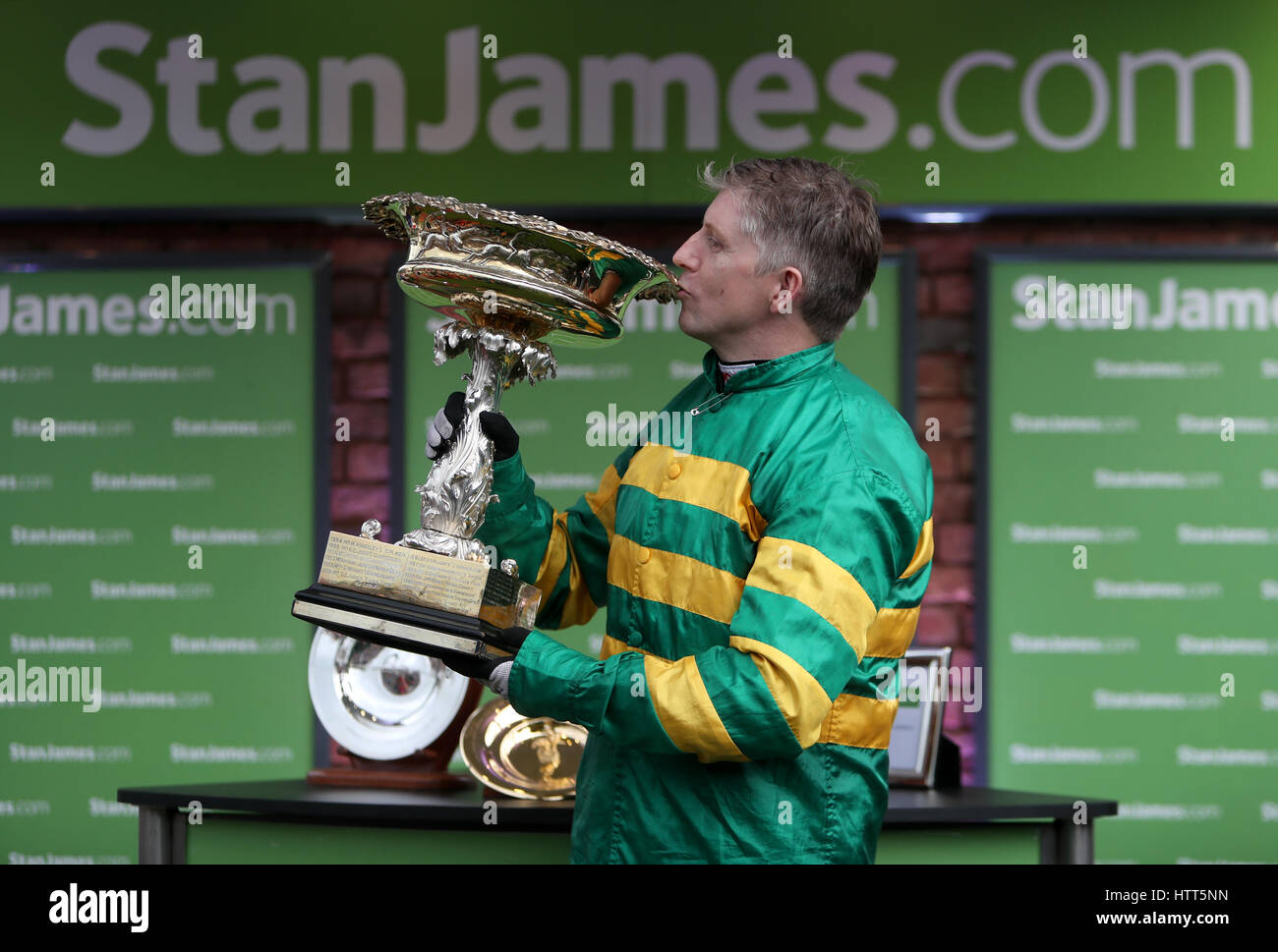 Jockey Noel Fehily with the Stan James Champion Hurdle Challenge Trophy during Champion Day of the 2017 Cheltenham Festival at Cheltenham Racecourse. PRESS ASSOCIATION Photo. Picture date: Tuesday March 14, 2017. See PA story RACING Cheltenham. Photo credit should read: David Davies/PA Wire. RESTRICTIONS: Editorial Use only, commercial use is subject to prior permission from The Jockey Club/Cheltenham Racecourse Stock Photo