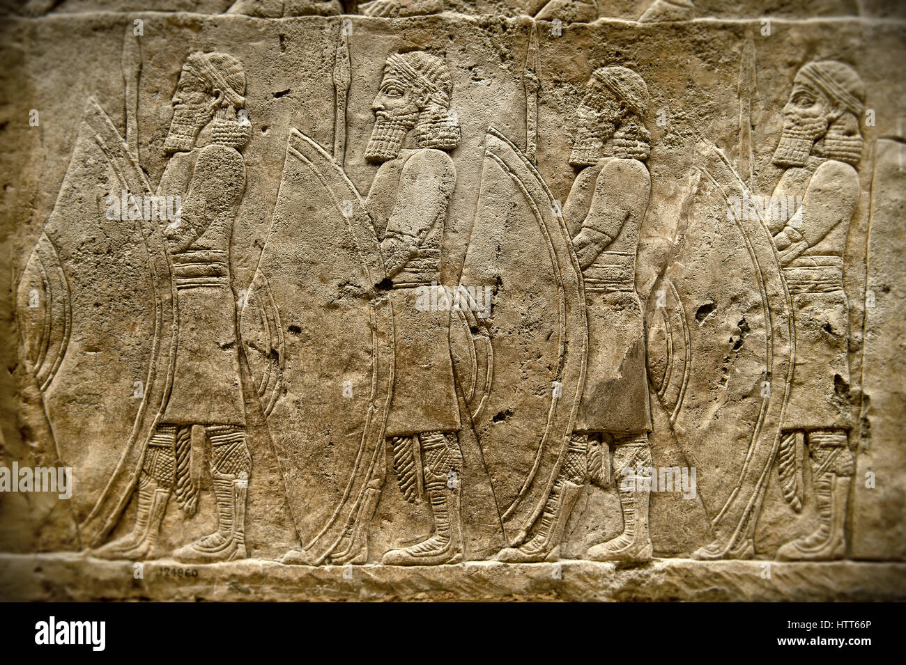 Assyrian relief sculpture panel of spearmen lining the road from the King  Ashurnasirpal lion hunt. From Nineveh North Palace, Iraq, 668-627 B.C. B  Stock Photo - Alamy