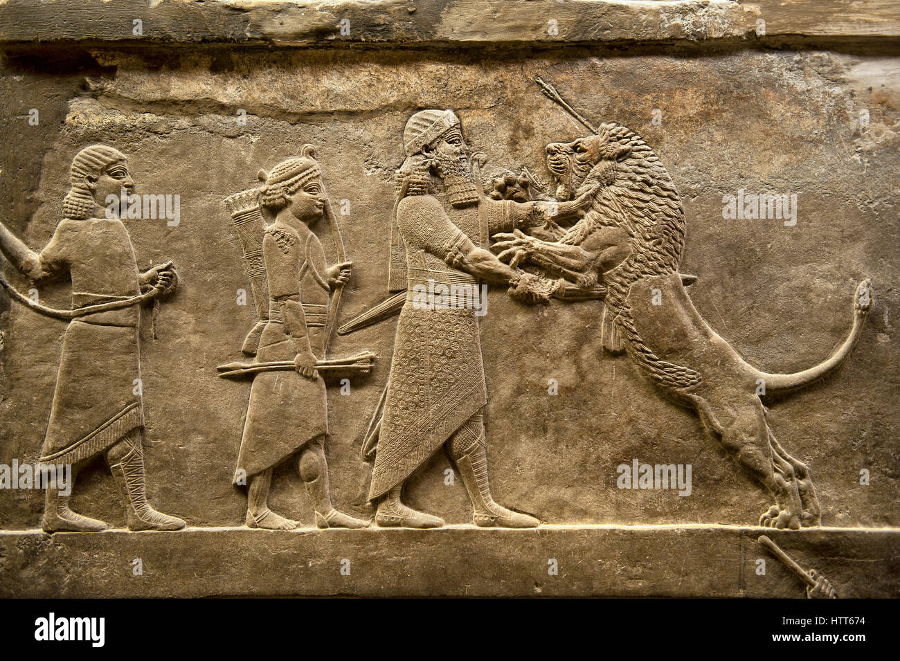 Assyrian relief sculpture panel of Ashurnasirpal lion hunting. From