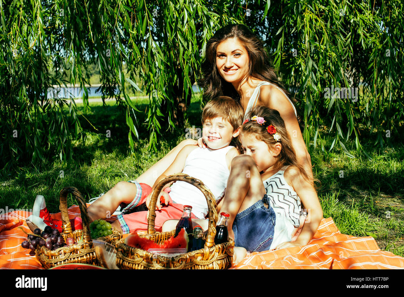cute happy family on picnic laying on green grass mother and kid Stock ...