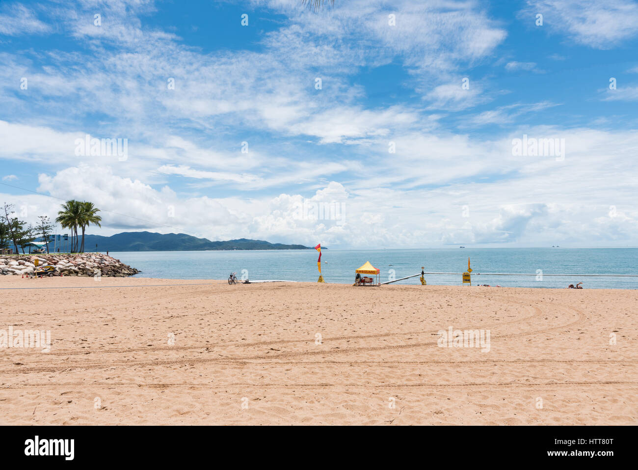 View to Magnetic Island from The Strand beach, Townsville, Australia with swimming nets Stock Photo
