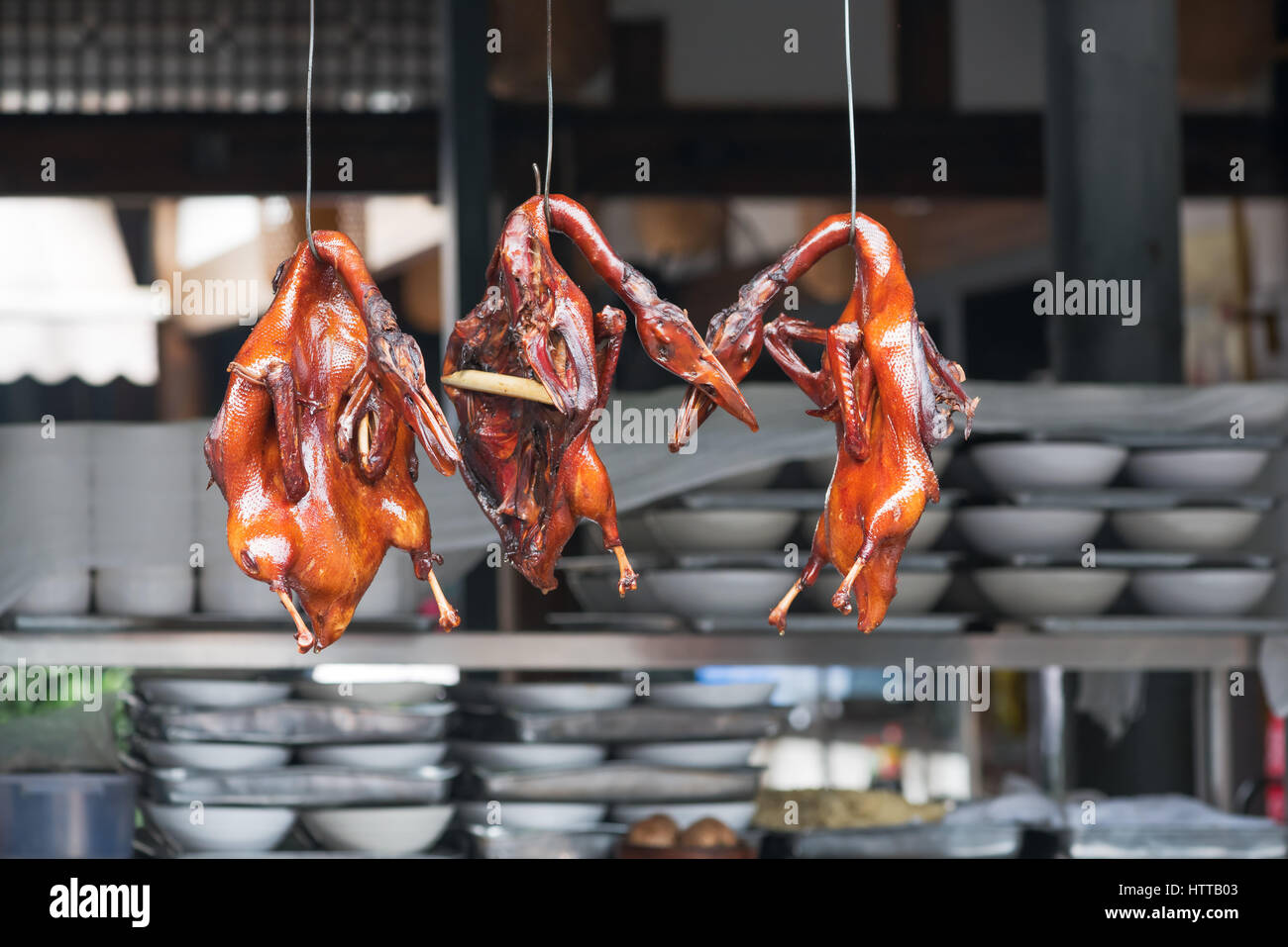 Peking duck hanging in a kitchen of a chinese restaurant Stock Photo