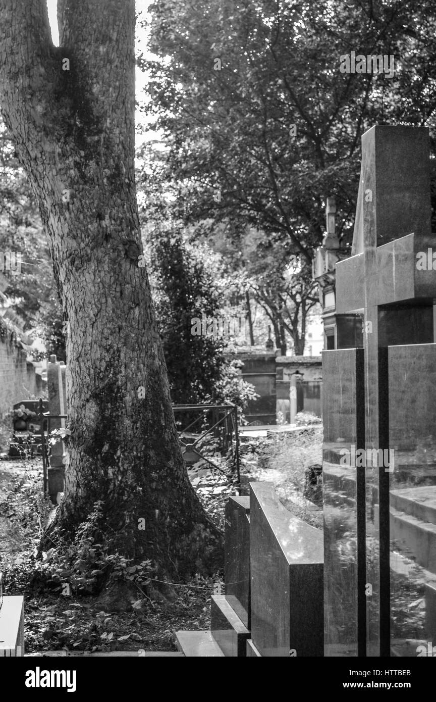 Tombs and crosses in Pere Lachaise Cemetery in Paris in black and white Stock Photo