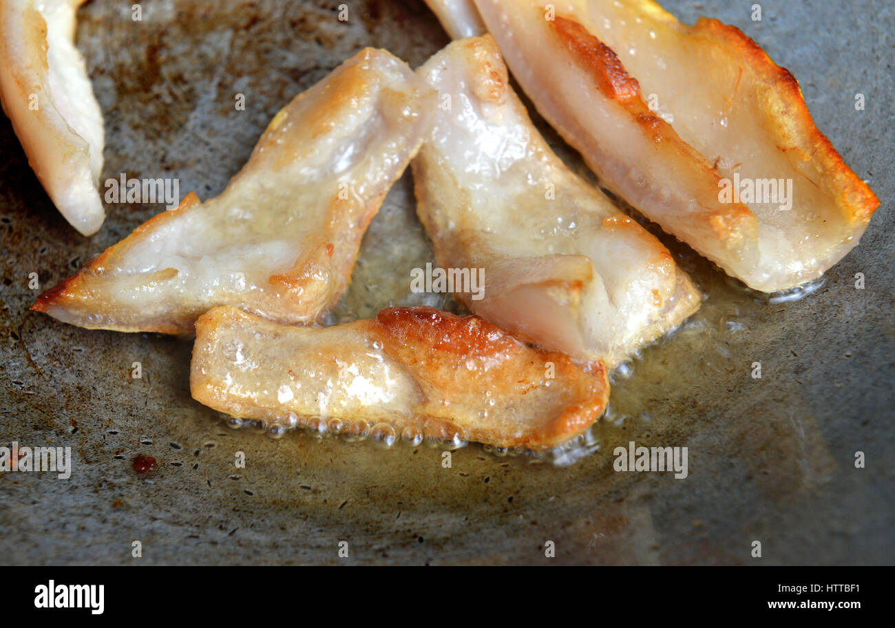 hot Fried pork skin in iron plate daylight Stock Photo Alamy