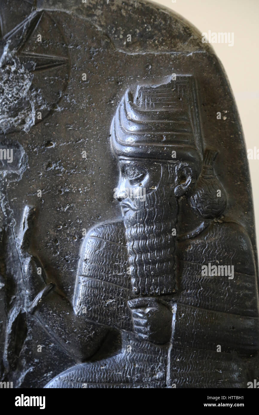 Babylonian stele usurped by Elamite King. Detail god. Basalt. 12th century BC. From Susa. Mesopotamia. Iraq. Louvre Museum. Stock Photo