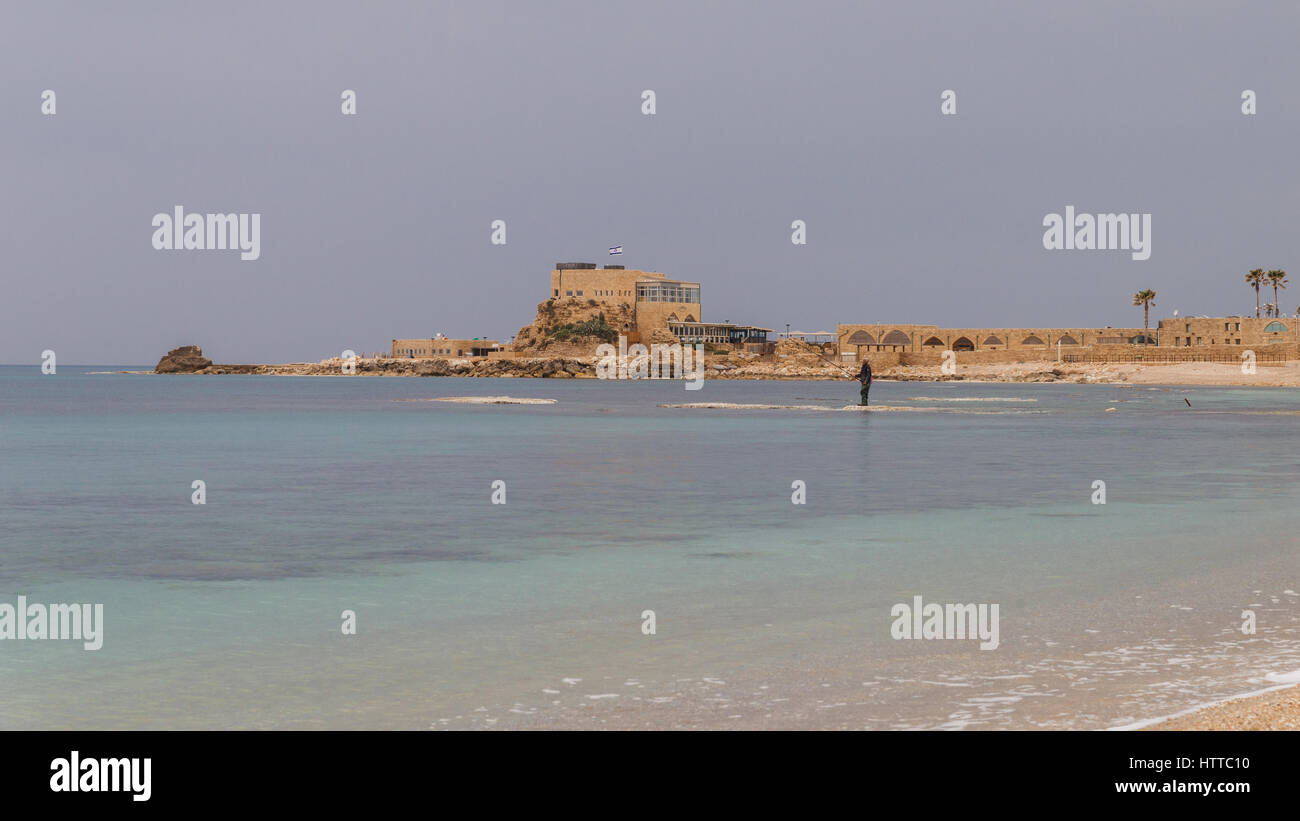 A fisherman on a territory of Maritima National Park in Caesarea, Israel Stock Photo