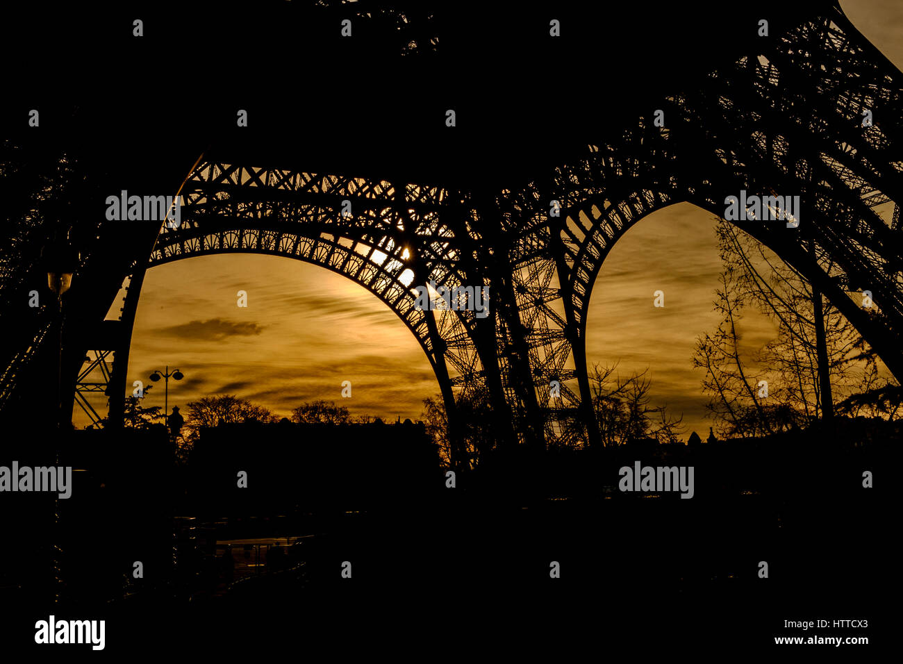 Silhouettes of the base of the Eiffel Tower Stock Photo