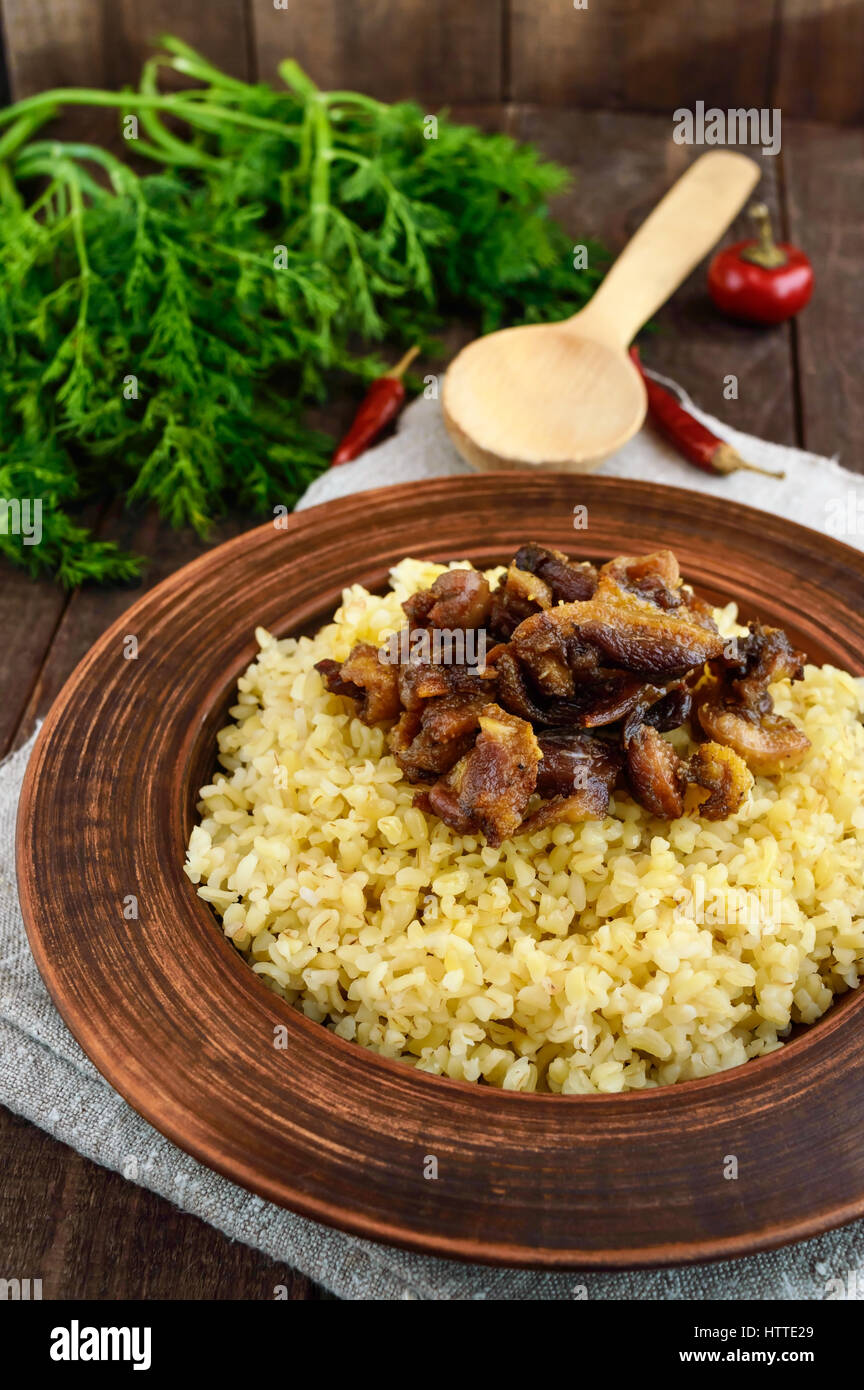 Bulgerty Eatable Eastern traditional wheat porridge - bulgur with roasted pieces fatty ...