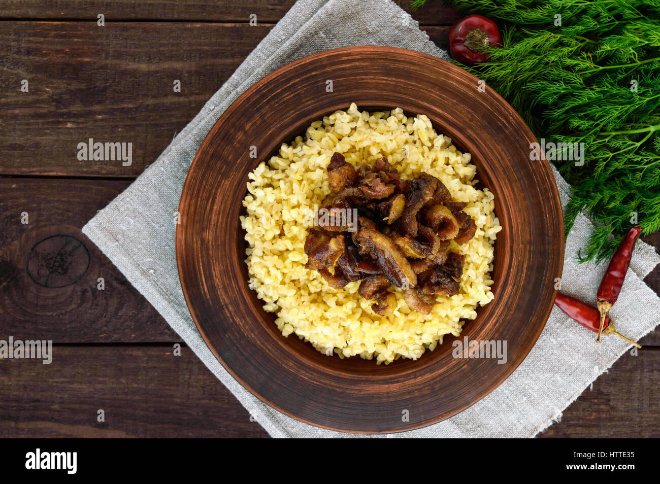 Bulgerty Eatable Eastern traditional wheat porridge - bulgur with roasted pieces fatty ...