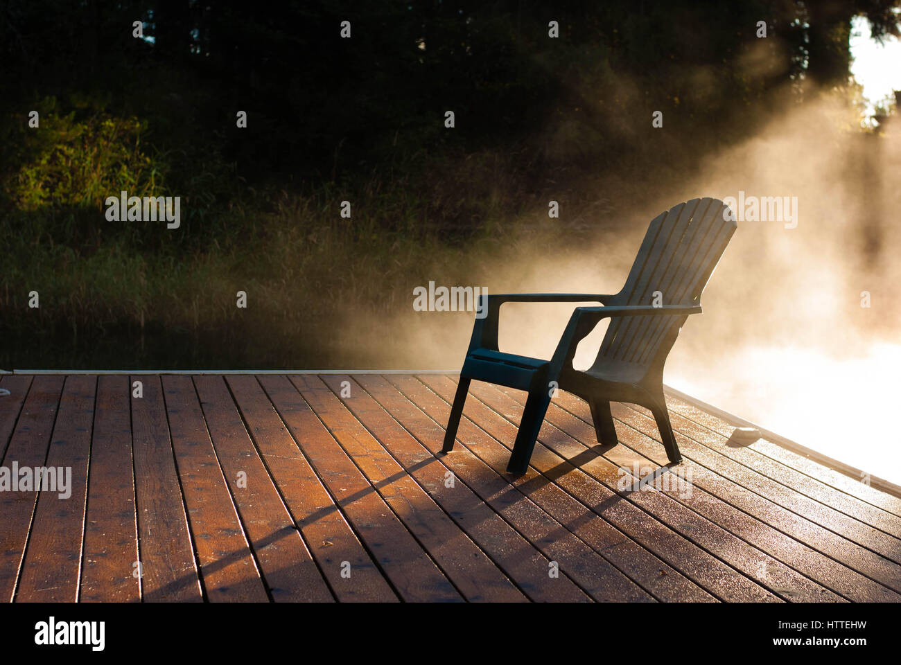 Adirondack chair on dock hi-res stock photography and images - Alamy