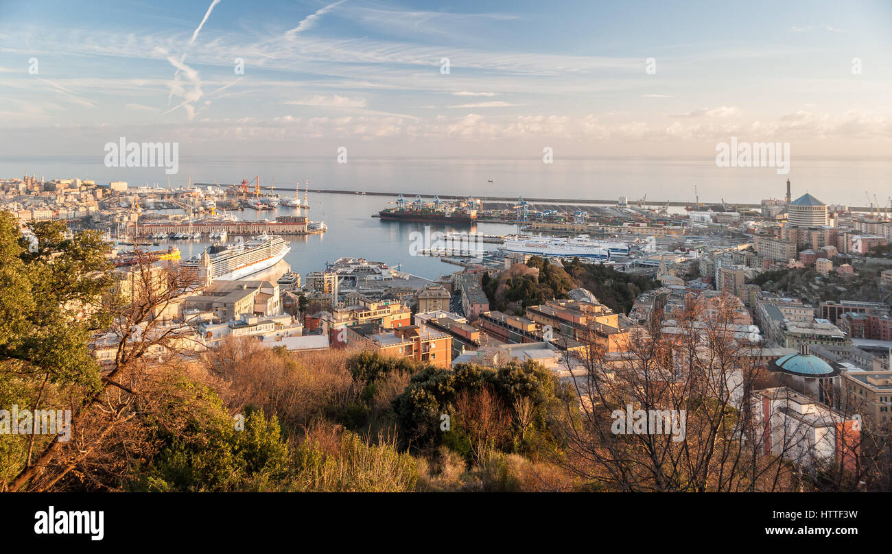 The harbor of Genoa seen from surrounding hills during the golden hour Stock Photo