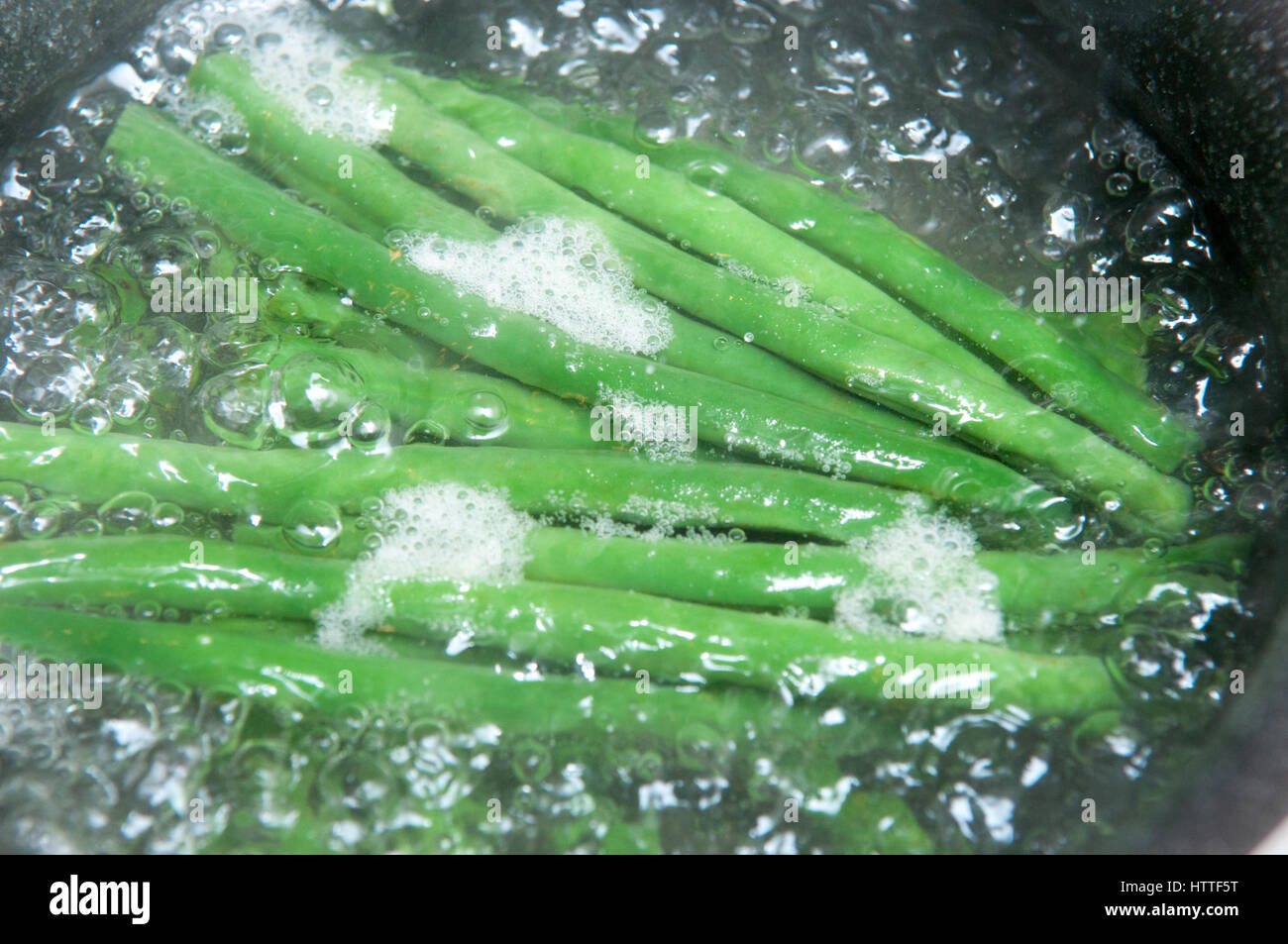 Fresh green beans cooking in water Stock Photo Alamy