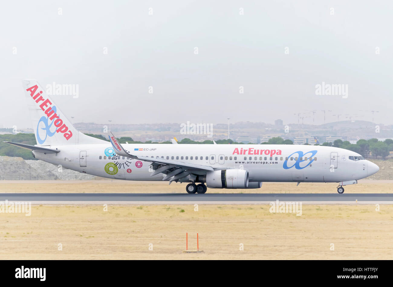 Plane Boeing 737, of Air Europa airline, is landing on Madrid - Barajas, Adolfo Suarez airport. Cloudy and hot day of summer. Stock Photo