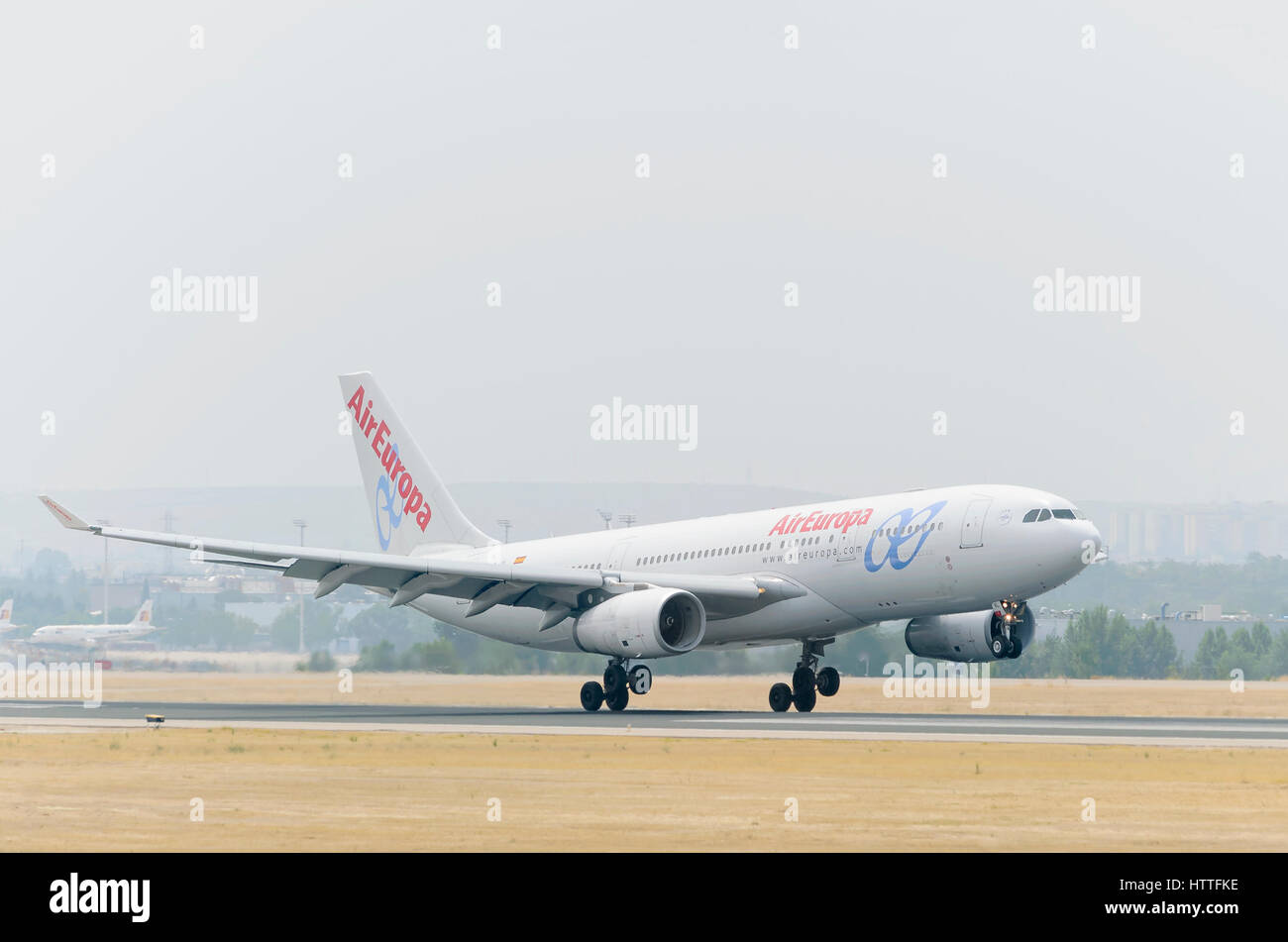 Plane Airbus A330, of Air Europa airline, is landing on Madrid - Barajas, Adolfo Suarez airport. Cloudy and hot day of summer. Stock Photo