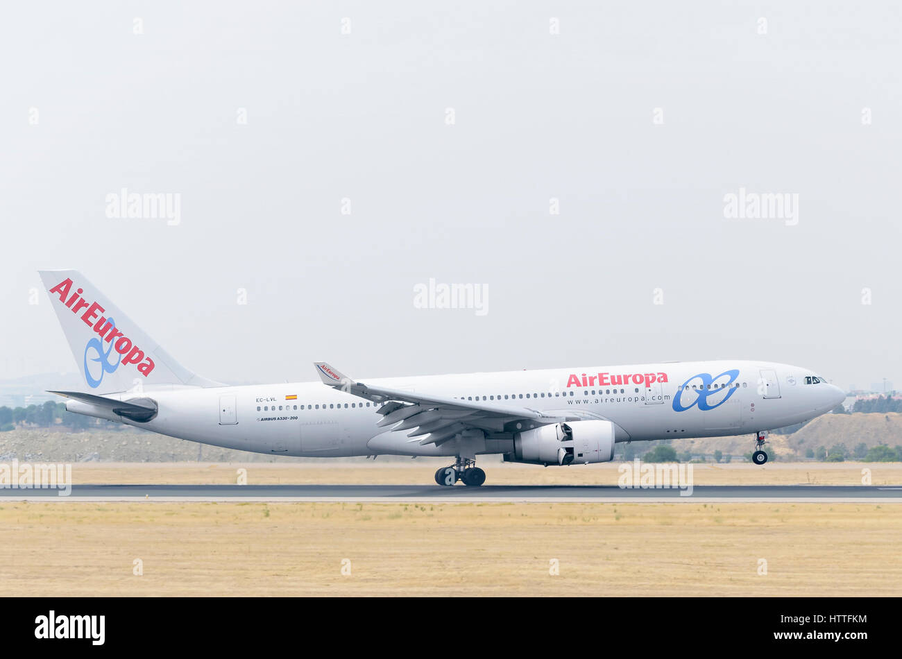 Plane Airbus A330, of Air Europa airline, is landing on Madrid - Barajas, Adolfo Suarez airport. Cloudy and hot day of summer. Stock Photo