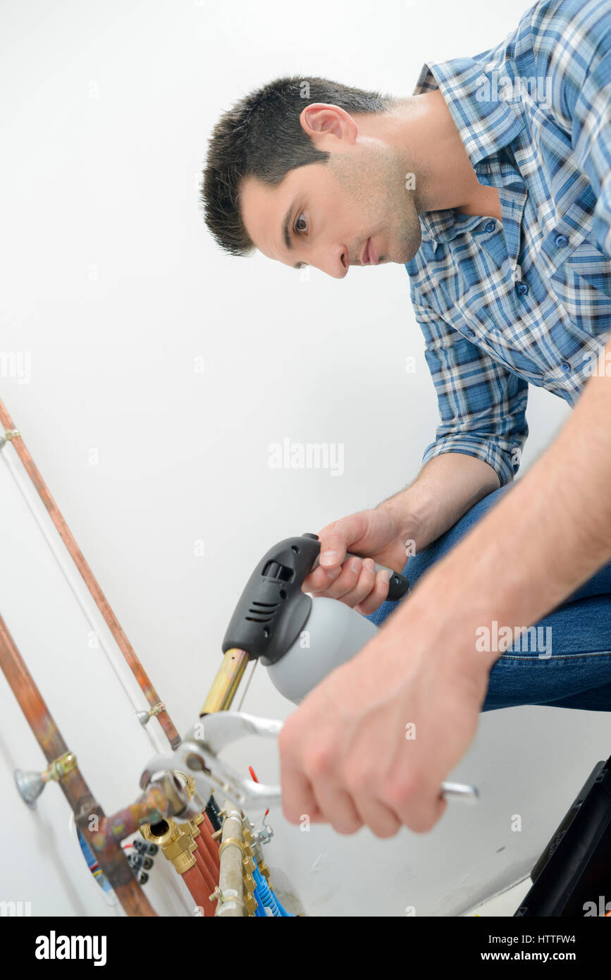 Plumber using a blow torch Stock Photo Alamy