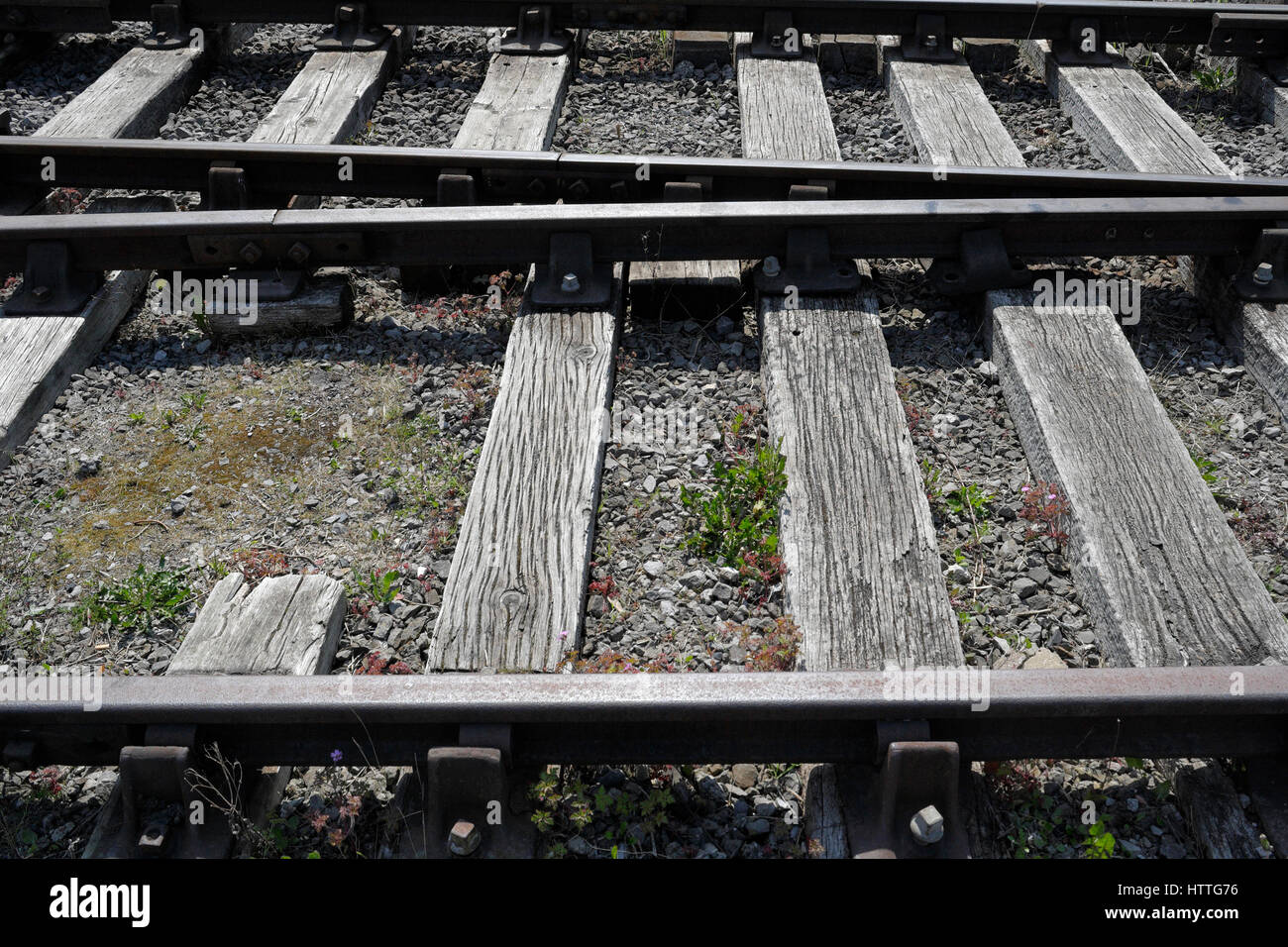 Rails on wooden sleepers, Bristol harbourside England UK. Railway tracks Stock Photo