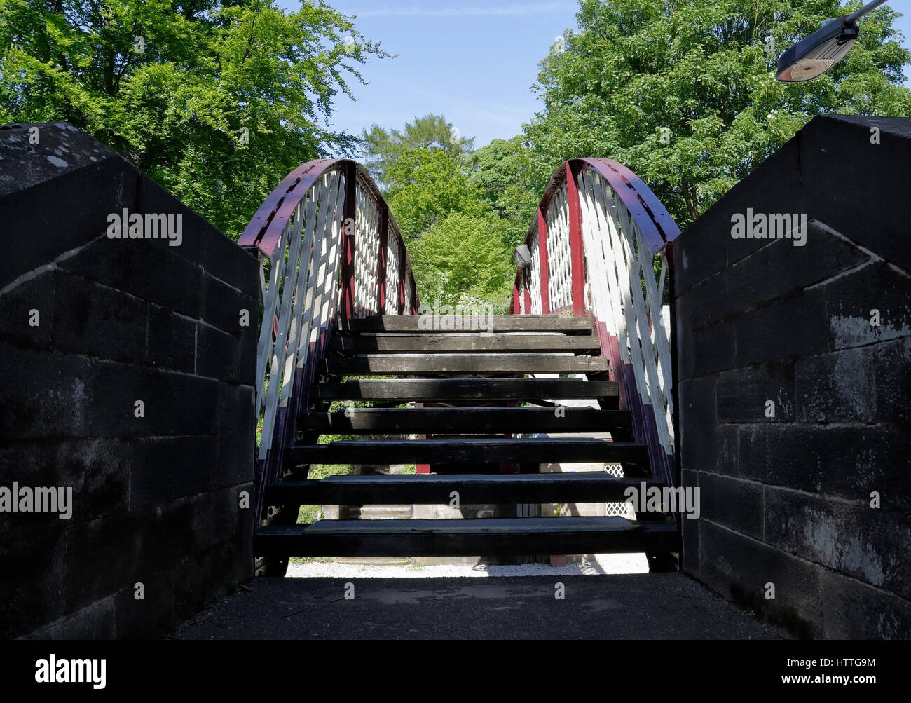 Wooden steps footbridge between platforms at Cromford railway station bridge, Derbyshire England UK Stock Photo