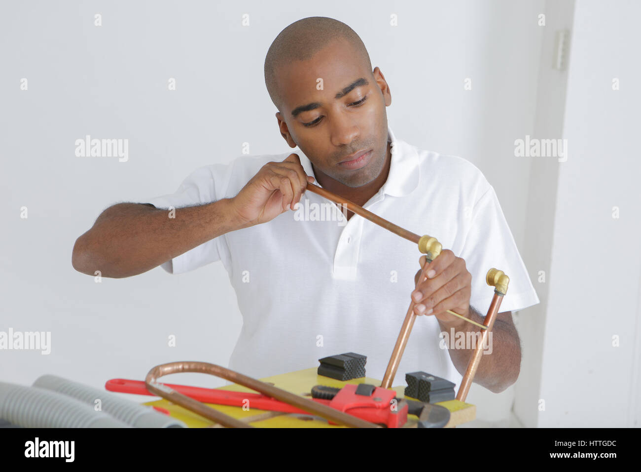Male fitting copper pipe together Stock Photo Alamy