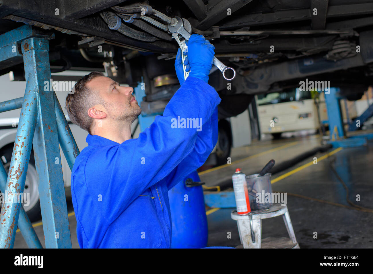 Mechanic working underneath a car Stock Photo Alamy