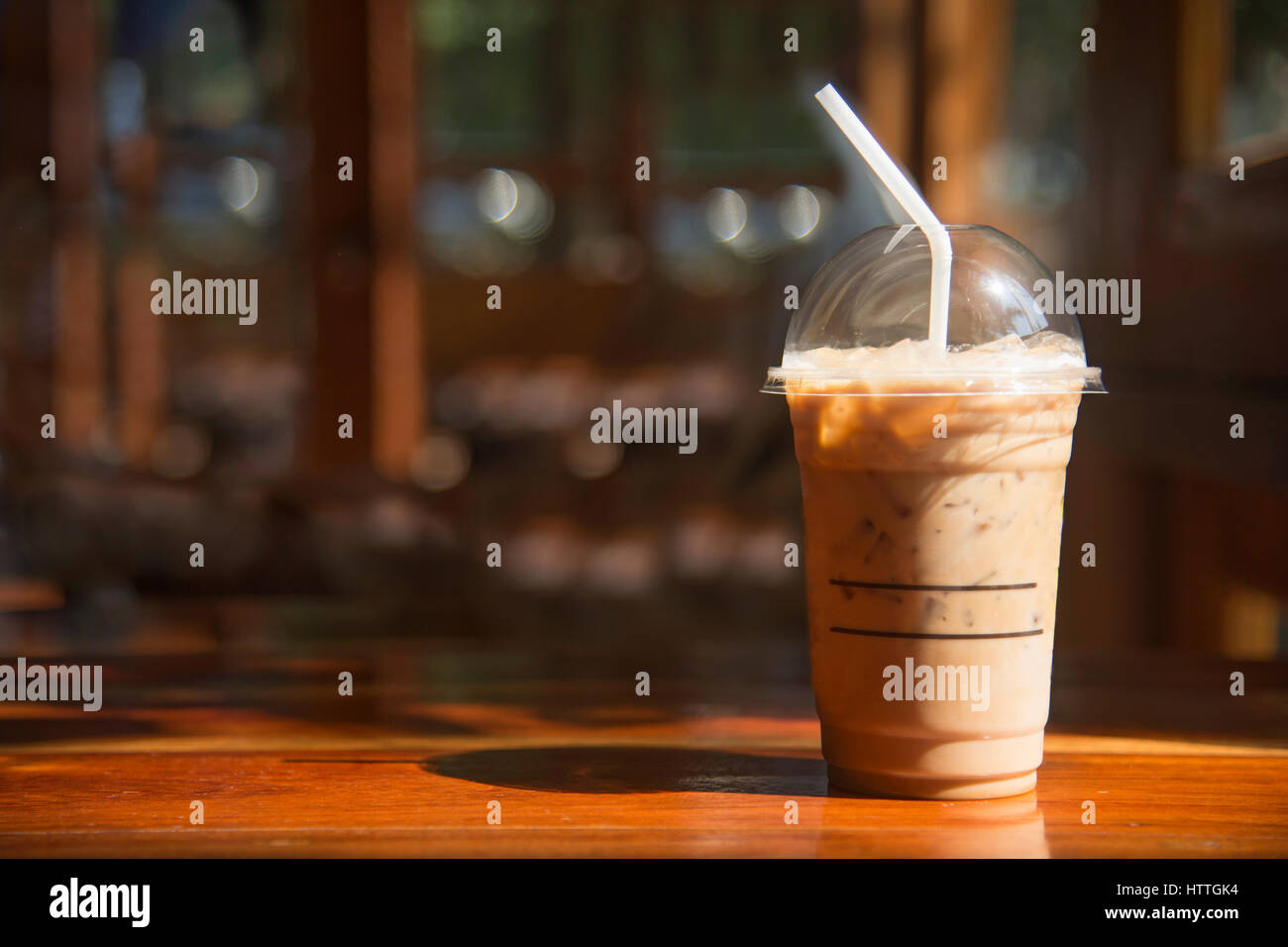 Plastic cup of cold coffee on white background Stock Photo - Alamy