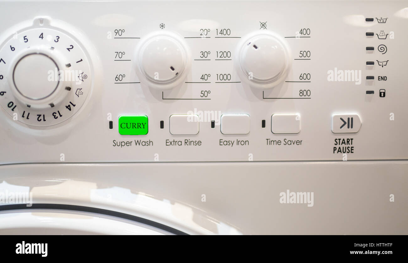 Curry remove button on washing machine Stock Photo - Alamy