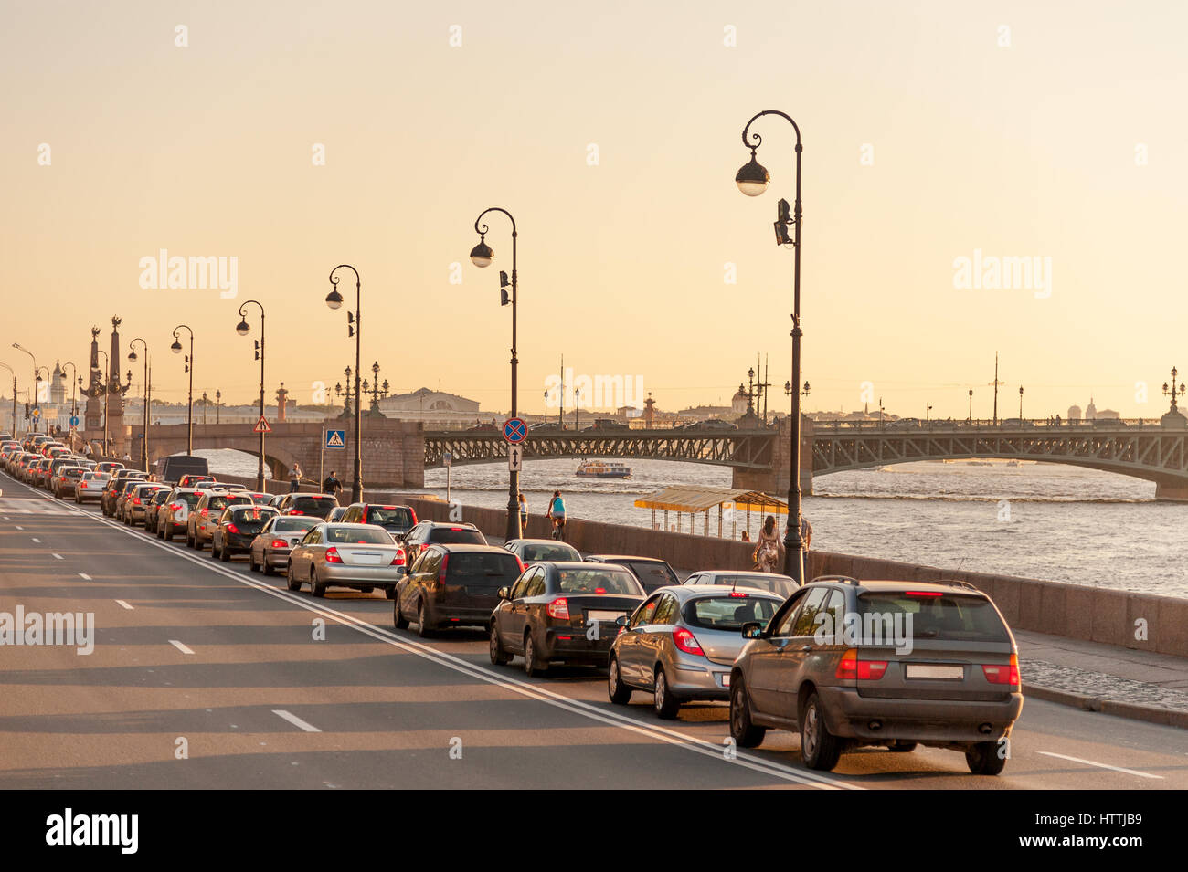 Evening traffic on Palace embankment and Trinity bridge in downtown Saint Petersburg Stock Photo