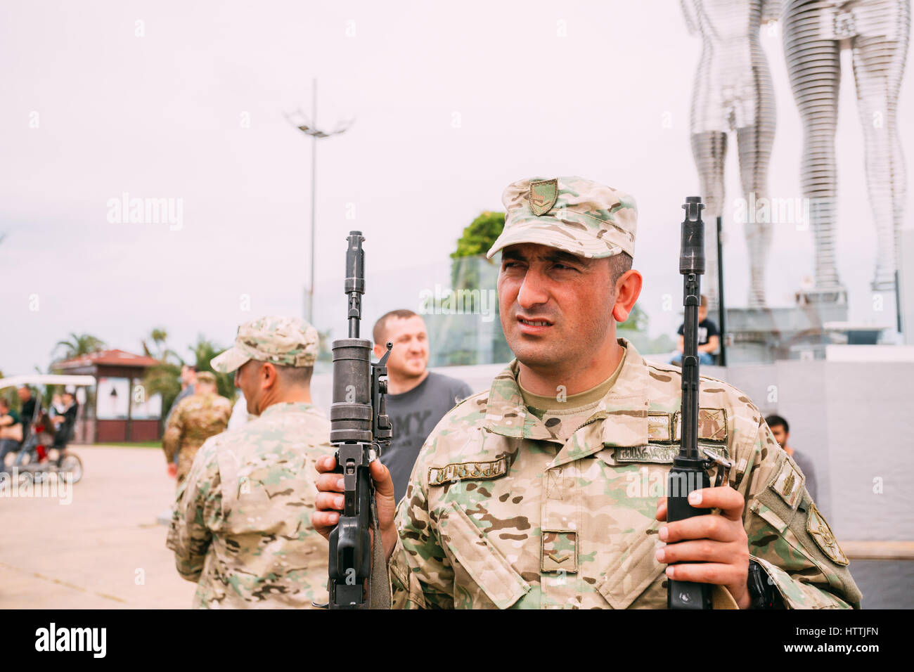 Batumi, Adjara, Georgia - May 26, 2016: Soldier holding M4 assault rifle at an exhibition of weapons during celebration of the national holiday - the  Stock Photo
