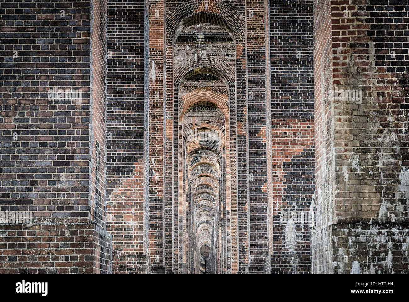 View through the brickwork and soffits of the Ouse Valley (Balcombe) Viaduct in West Sussex, UK Stock Photo