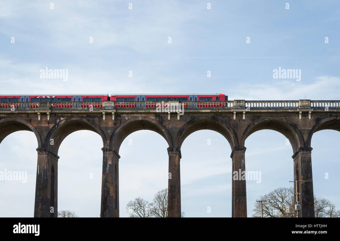 View of Gatwick Express train travelling over the Ouse Valley (Balcombe) Viaduct, West Sussex, UK Stock Photo