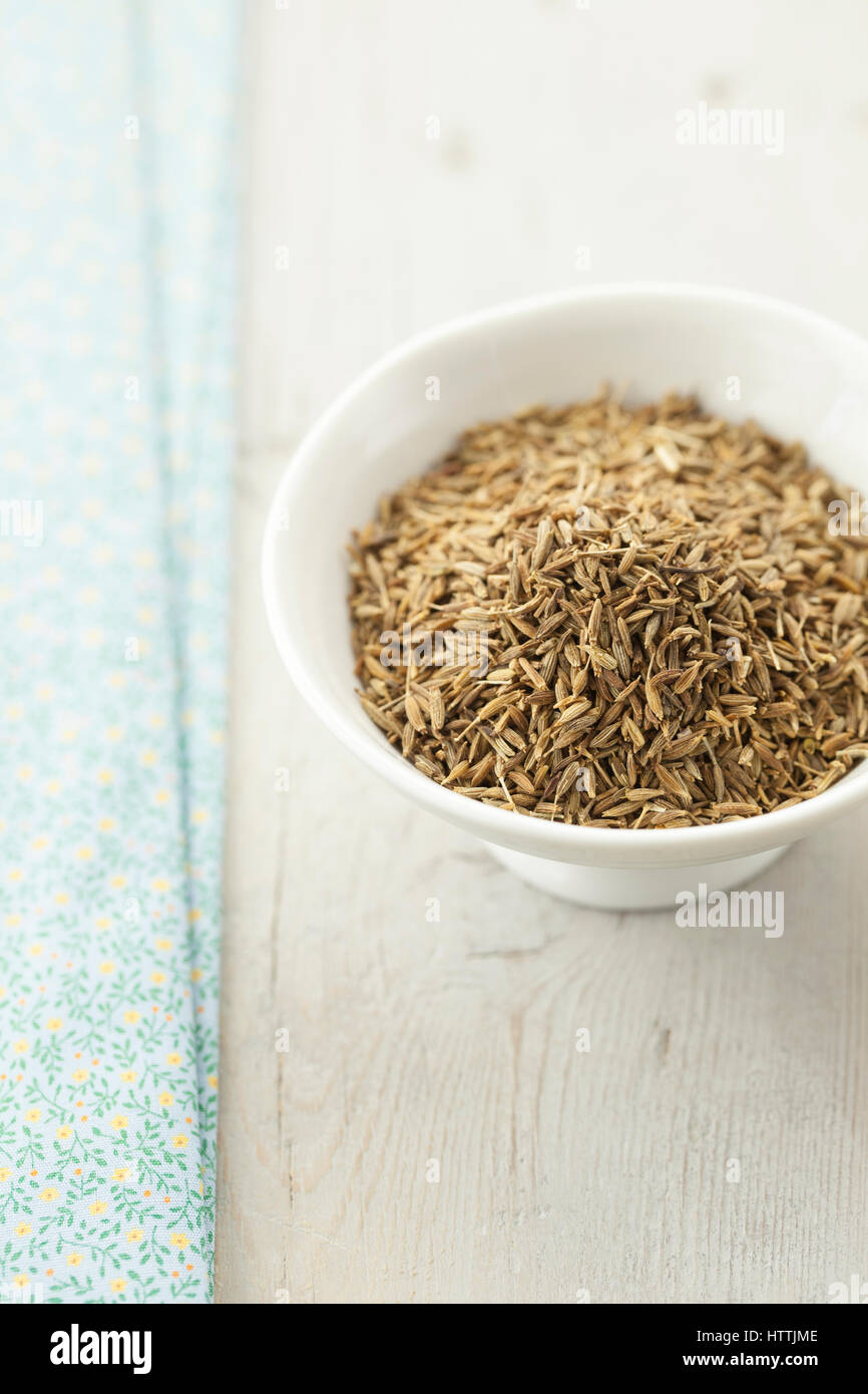 Cumin Seeds in Small White Bowl Stock Photo